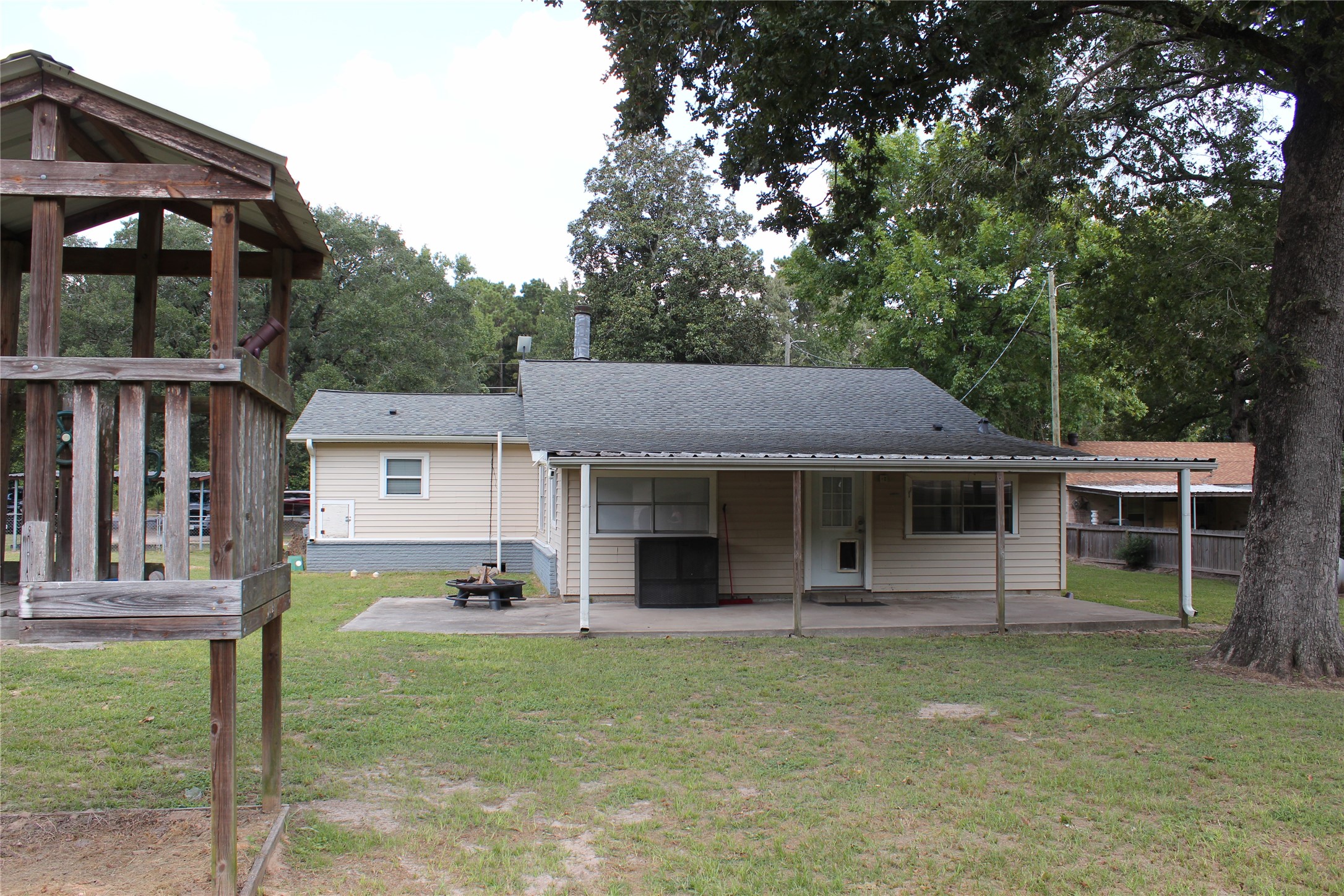 14040 FM 1484 Road Conroe, TX 77303 - Photo 32 of 47 a view of a house with a yard and plants