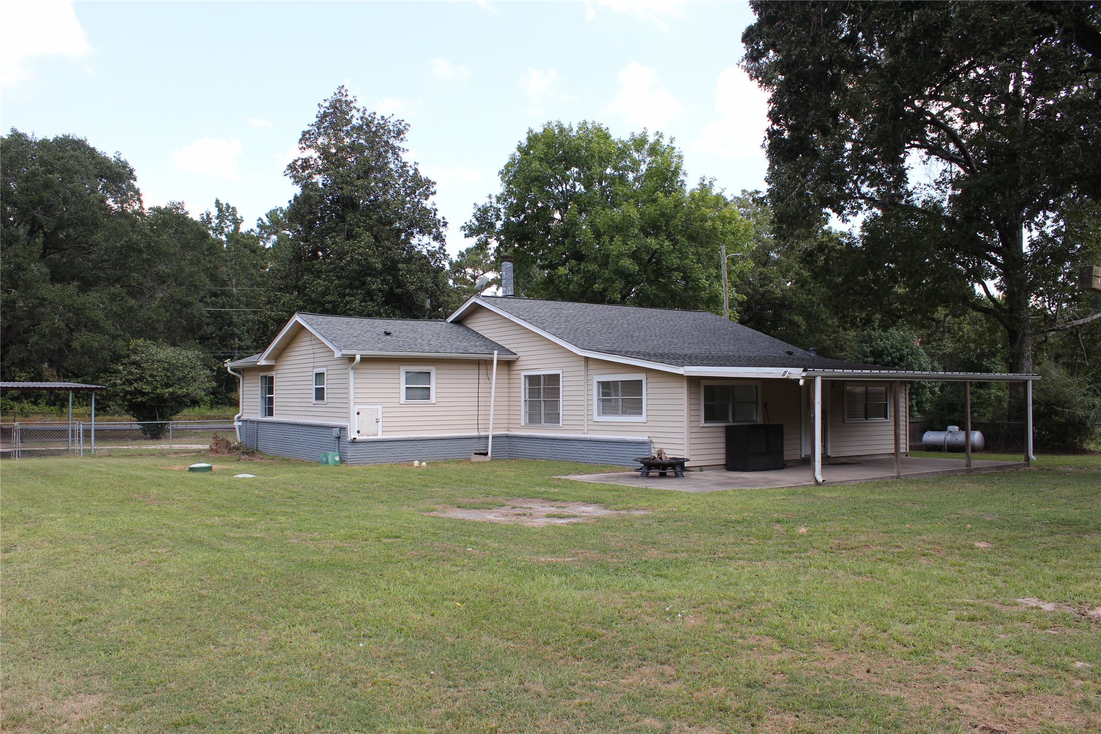 14040 FM 1484 Road Conroe, TX 77303 - Photo 34 of 47 a view of a house with a yard and sitting area