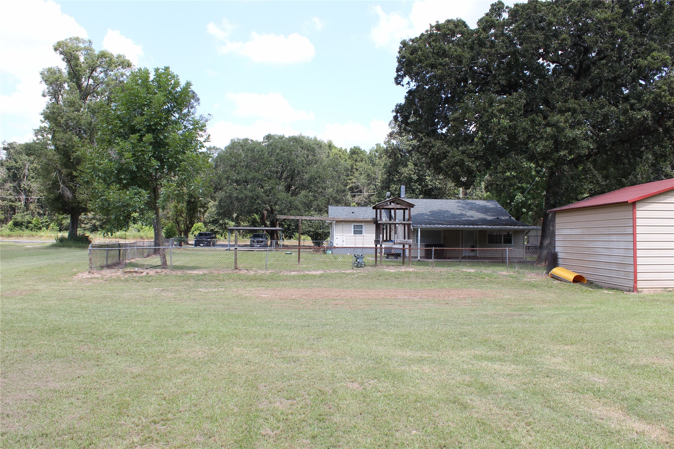 14040 FM 1484 Road Conroe, TX 77303 - Photo 40 of 47 a view of a house with backyard and a tree