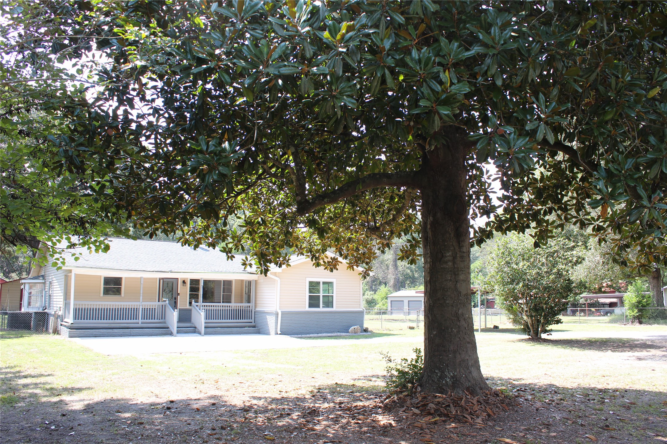 14040 FM 1484 Road Conroe, TX 77303 - Photo 4 of 47 a view of a house with a tree in the yard