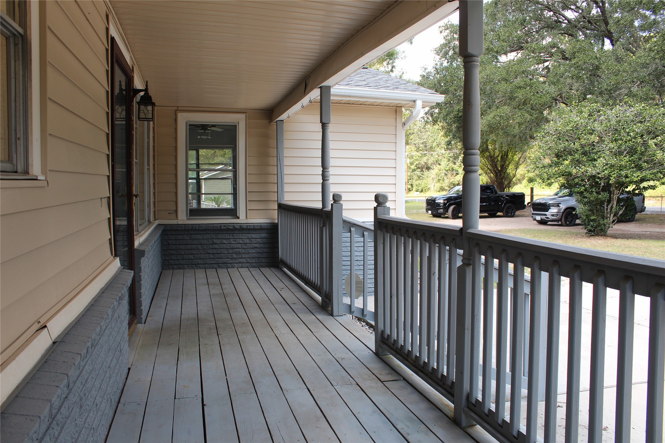 14040 FM 1484 Road Conroe, TX 77303 - Photo 6 of 47 a view of balcony with wooden floor and fence