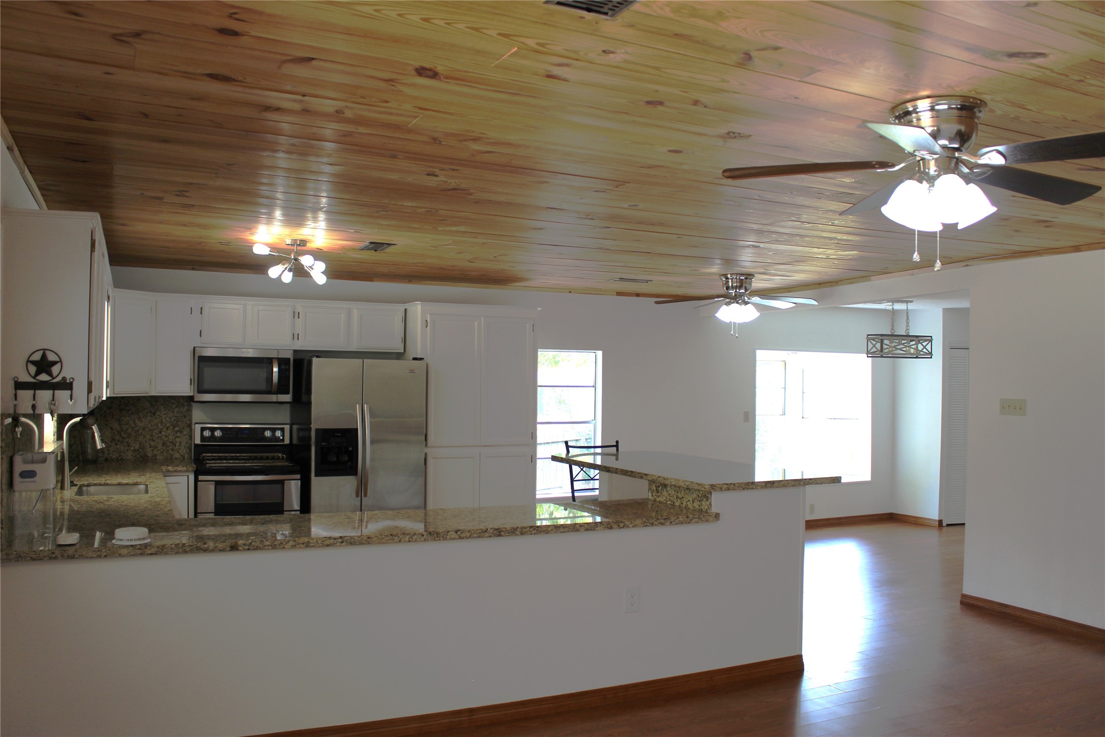 14040 FM 1484 Road Conroe, TX 77303 - Photo 7 of 47 a view of a dining room with furniture