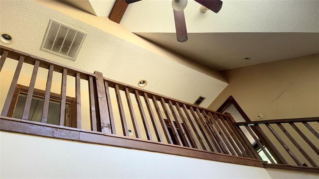 6582 Taylor Road Kaufman, TX 75142 - Photo 12 of 40 a view of staircase with railing and white walls