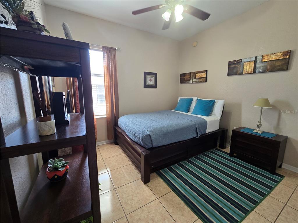 219 Cloverdale Road Winter Haven, FL 33884 - Photo 18 of 29 a bedroom with a bed and dresser