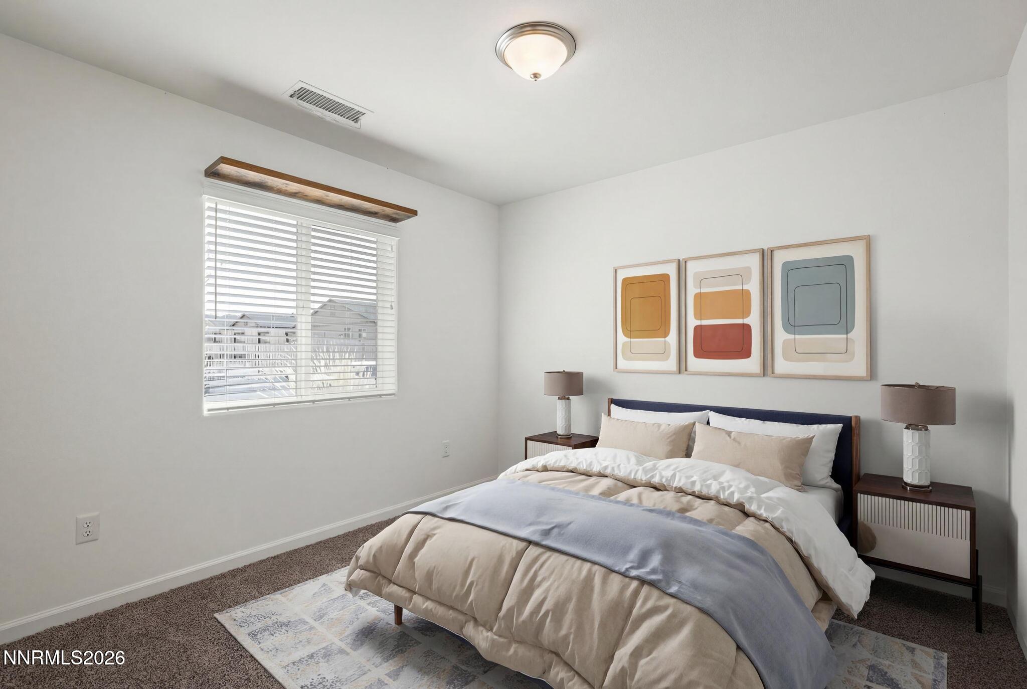 7709 Sandy Valley Drive Reno, NV 89506 - Photo 22 of 35 a bedroom with a bed and a window
