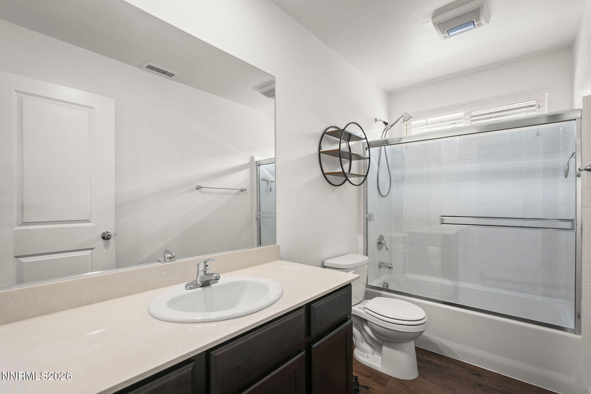 7709 Sandy Valley Drive Reno, NV 89506 - Photo 24 of 35 a bathroom with a sink a toilet and shower