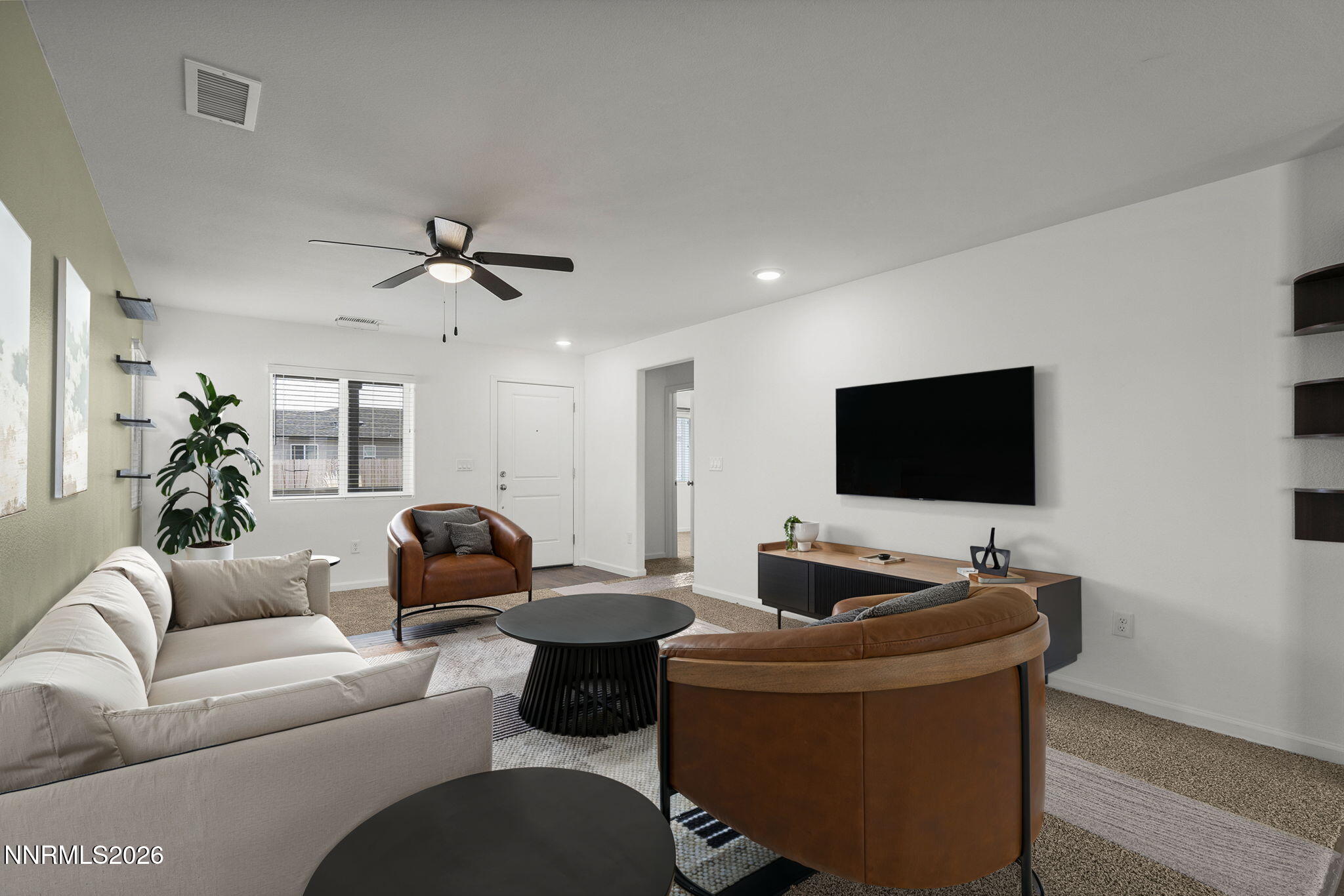 7709 Sandy Valley Drive Reno, NV 89506 - Photo 9 of 35 a living room with furniture and a flat screen tv