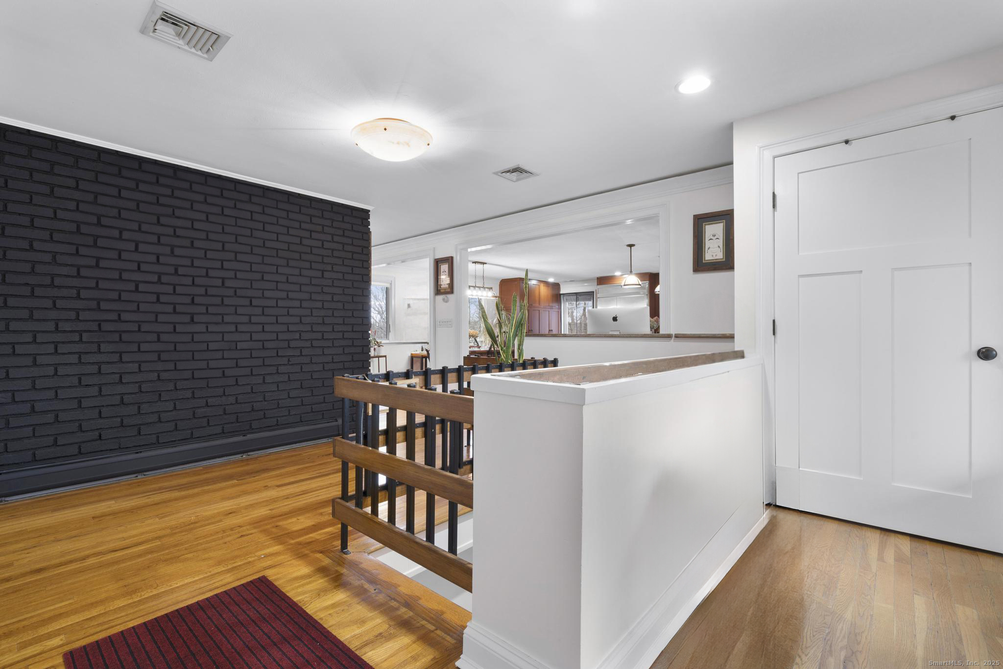 57 Gray Rock Road Trumbull, CT 06611 - Photo 21 of 40 a kitchen with refrigerator and chairs