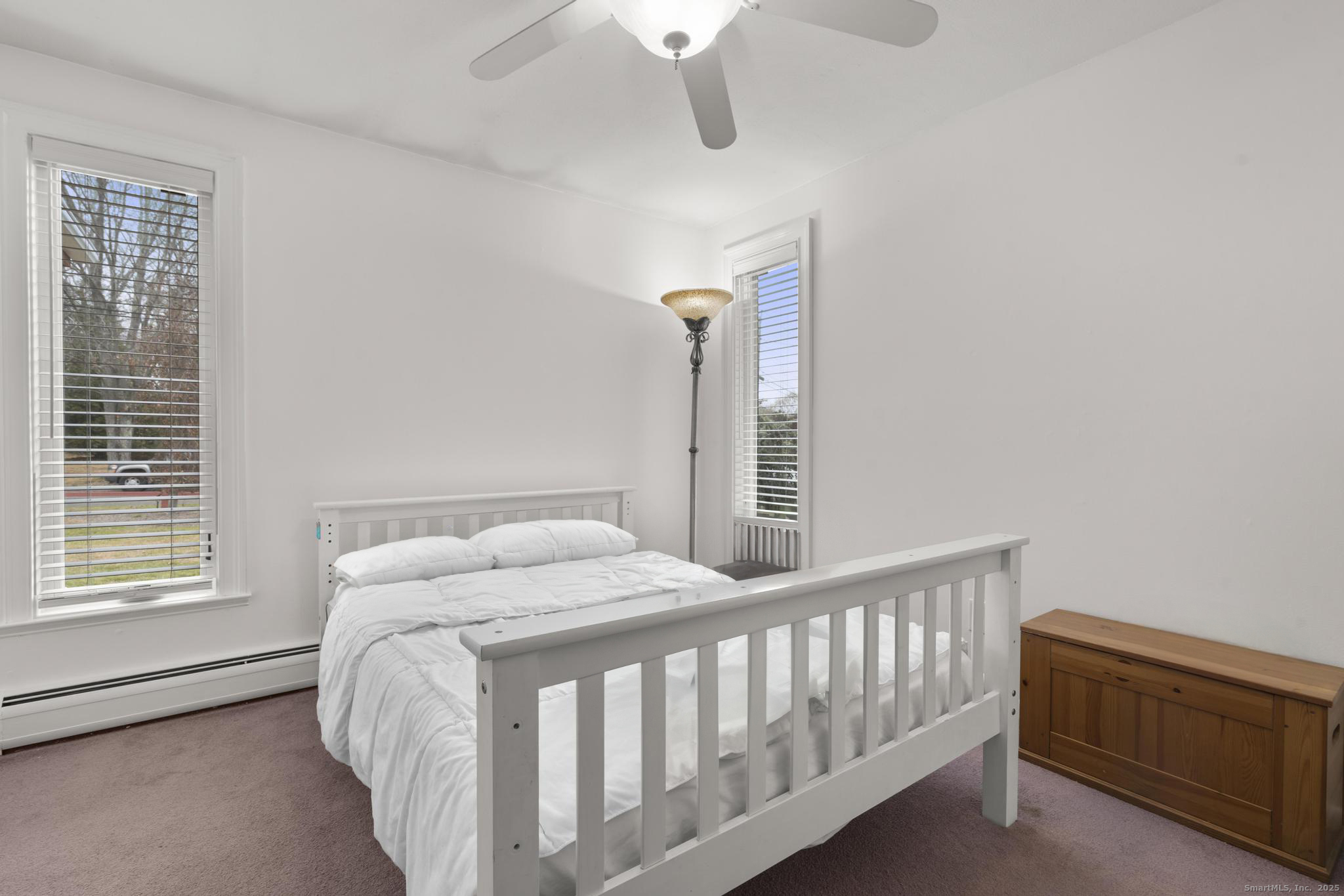 57 Gray Rock Road Trumbull, CT 06611 - Photo 27 of 40 a bed sitting in a bedroom next to a window