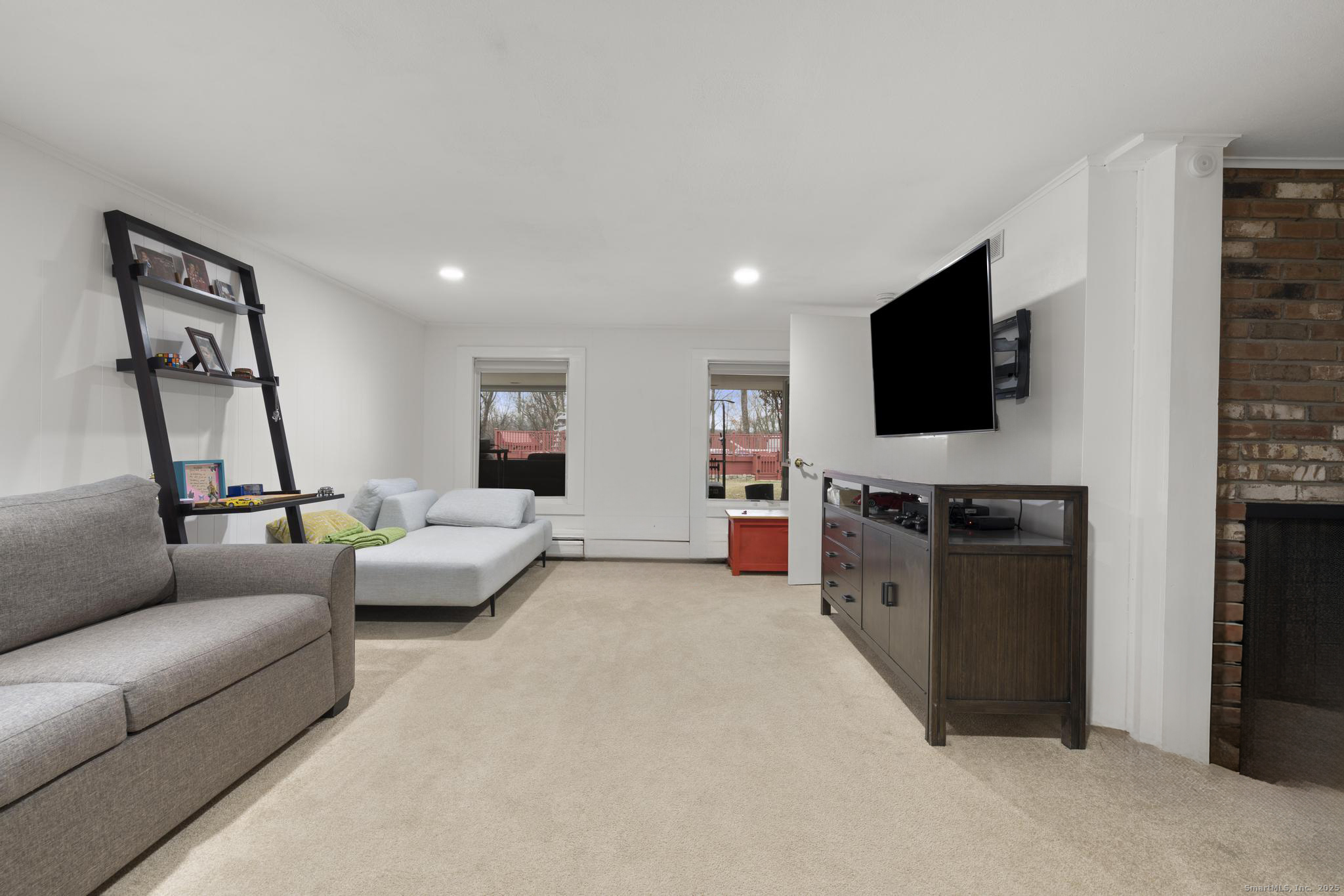 57 Gray Rock Road Trumbull, CT 06611 - Photo 30 of 40 a living room with furniture and a flat screen tv