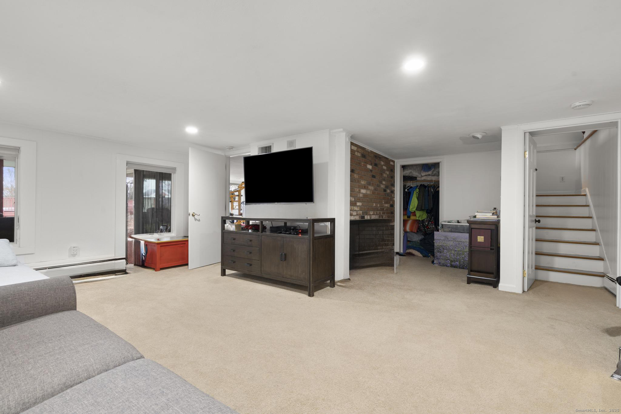 57 Gray Rock Road Trumbull, CT 06611 - Photo 31 of 40 a view of a livingroom with furniture and a flat screen tv