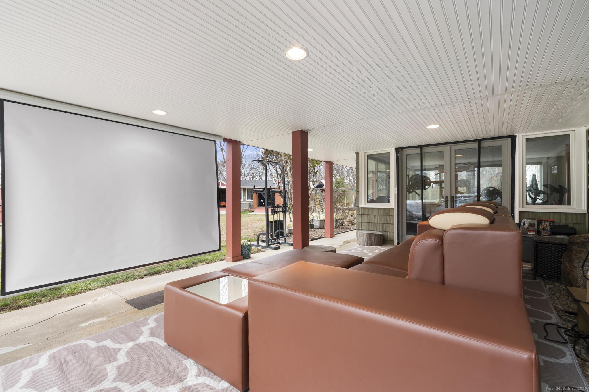 57 Gray Rock Road Trumbull, CT 06611 - Photo 35 of 40 a living room with furniture and a floor to ceiling window