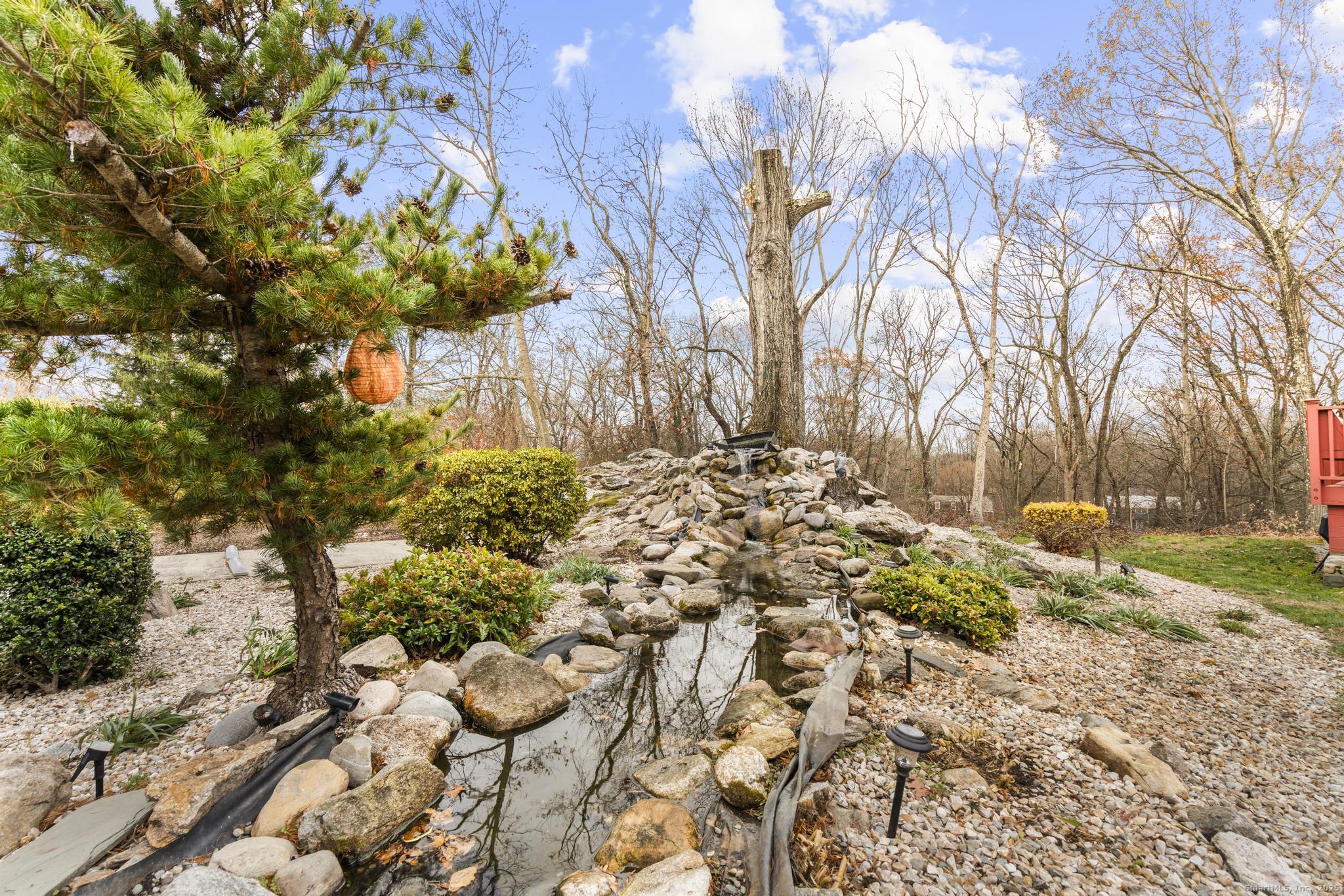 57 Gray Rock Road Trumbull, CT 06611 - Photo 37 of 40 a view of a yard with plants and trees