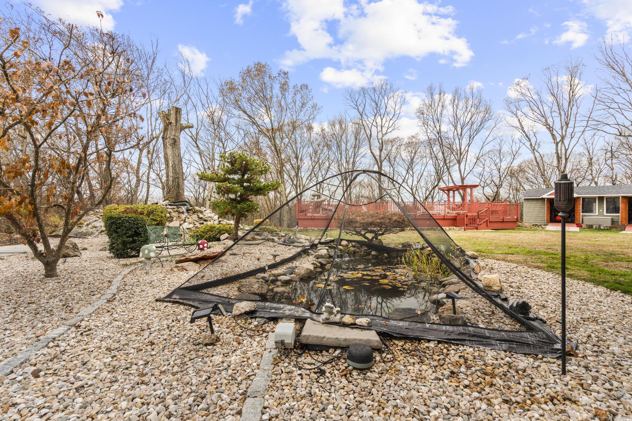 57 Gray Rock Road Trumbull, CT 06611 - Photo 38 of 40 a bench sitting in the middle of a yard