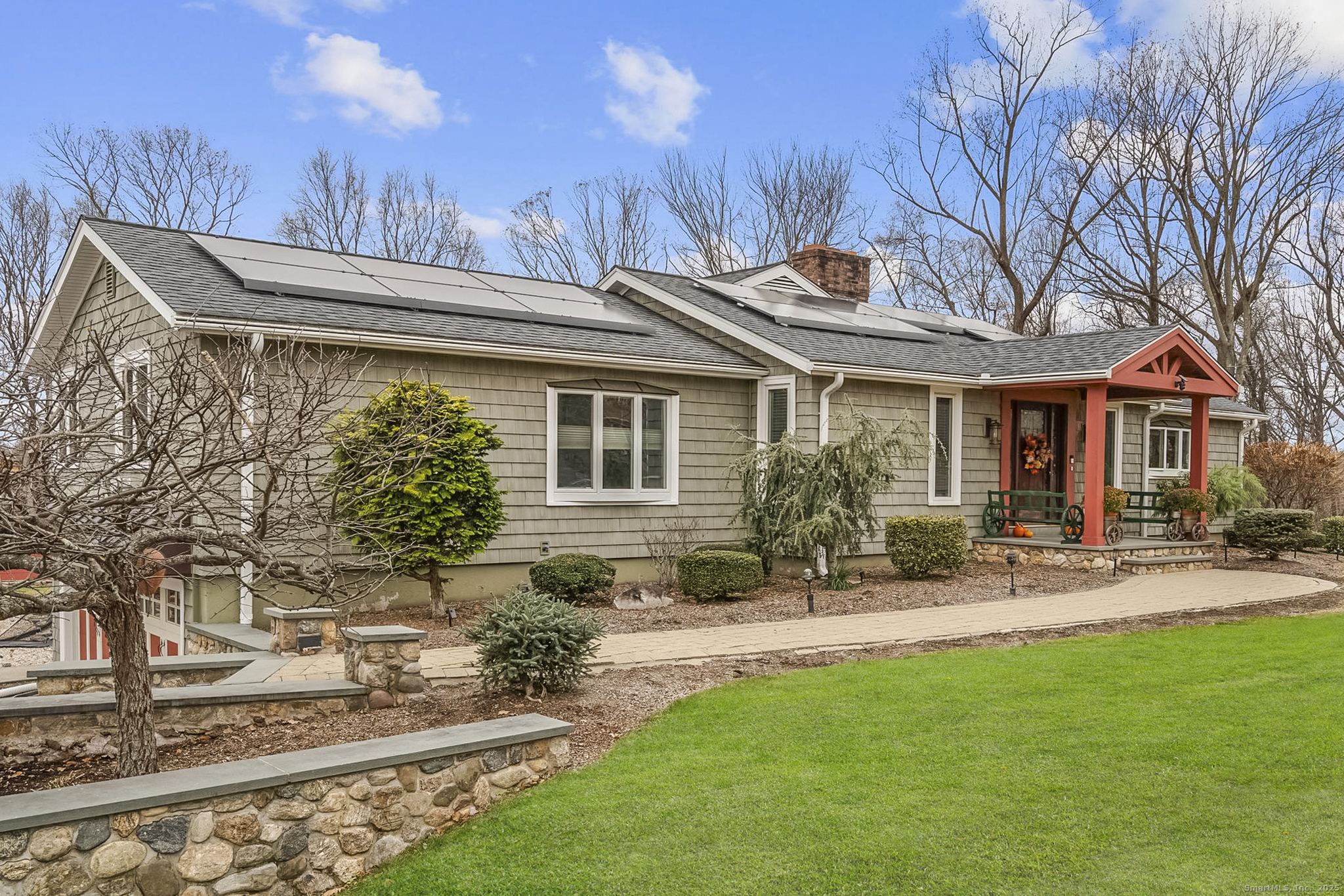 57 Gray Rock Road Trumbull, CT 06611 - Photo 39 of 40 a backyard of a house with table and chairs