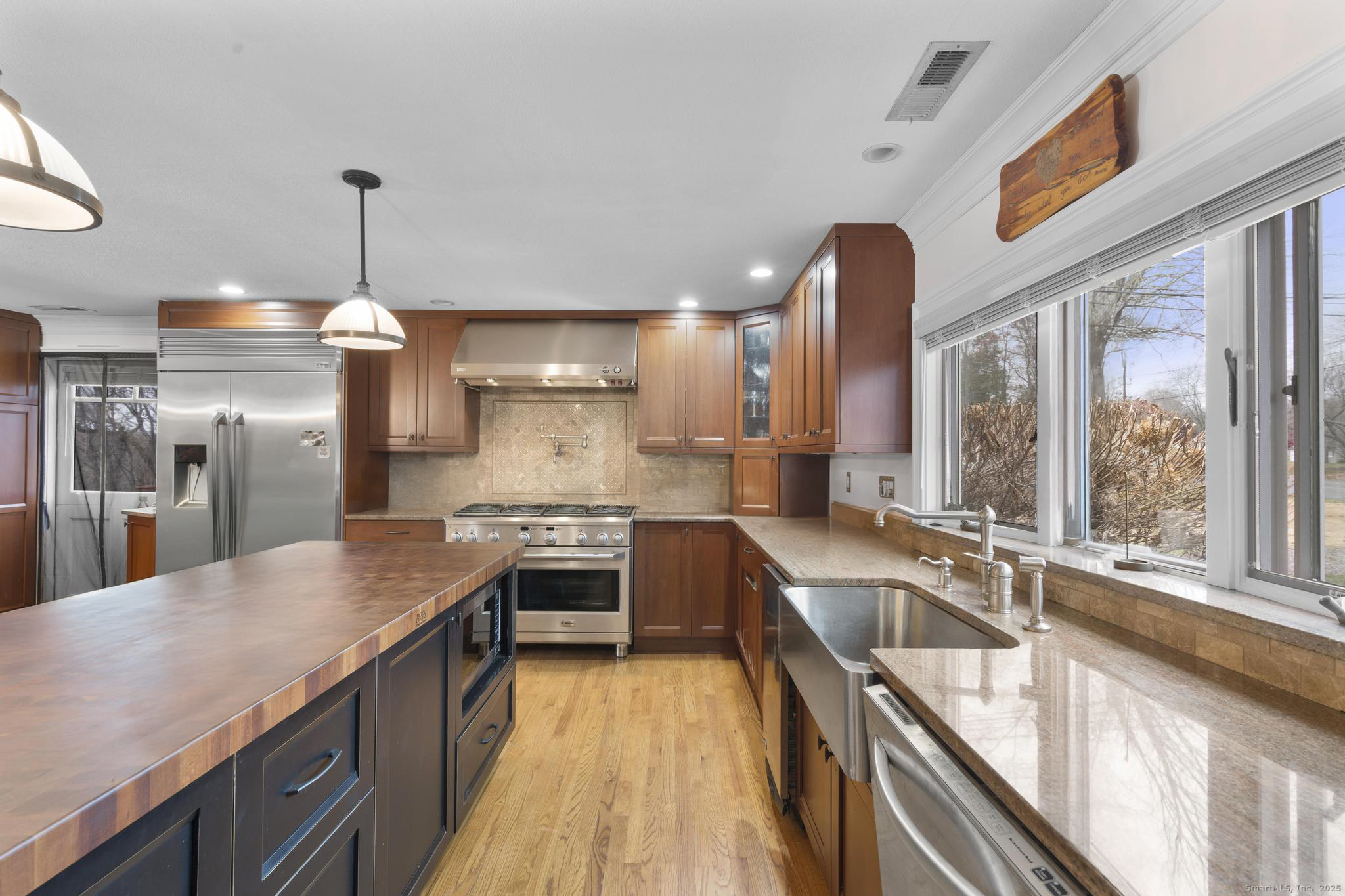 57 Gray Rock Road Trumbull, CT 06611 - Photo 4 of 40 a kitchen with stainless steel appliances granite countertop a sink a stove and a refrigerator