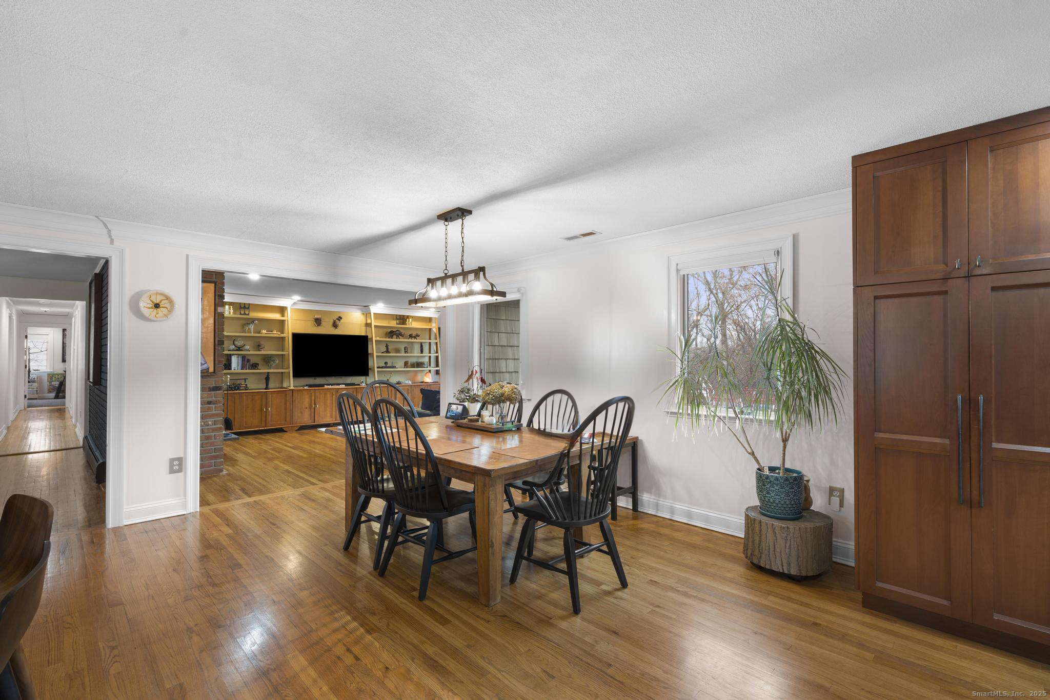 57 Gray Rock Road Trumbull, CT 06611 - Photo 8 of 40 a view of a dining room with furniture window and wooden floor