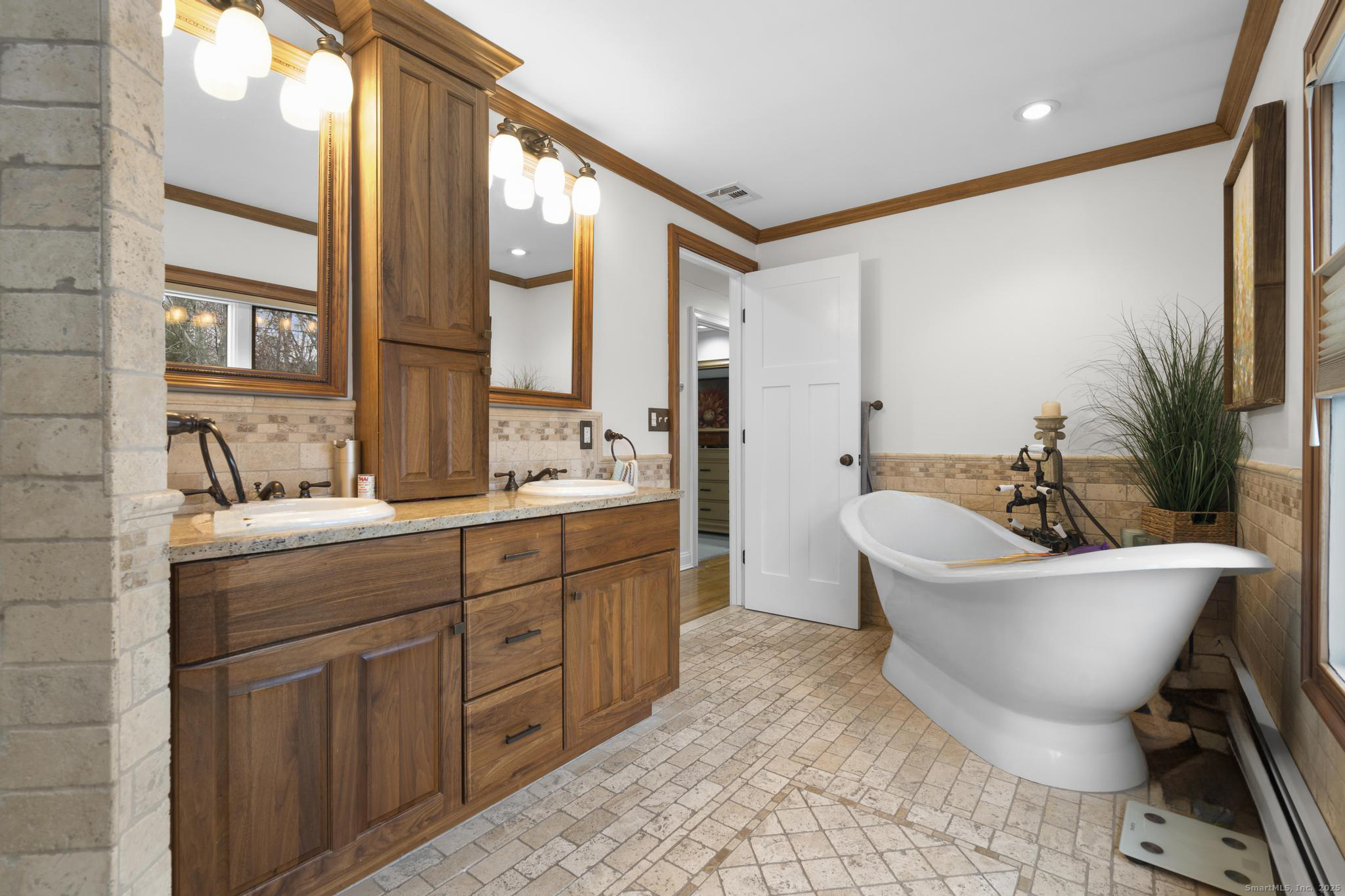 57 Gray Rock Road Trumbull, CT 06611 - Photo 10 of 40 a spacious bathroom with a double vanity sink a mirror and a bathtub