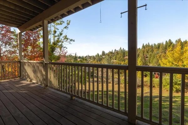 a view of balcony with wooden floor