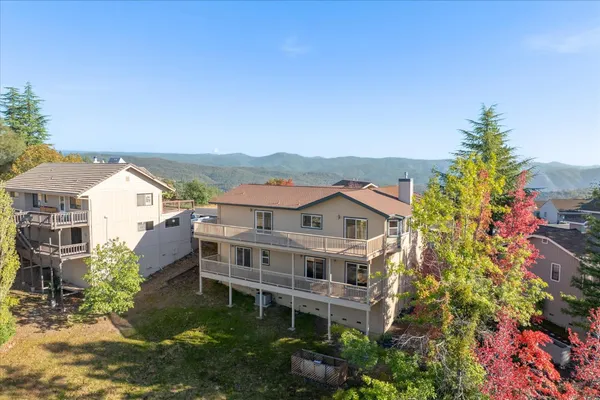 an aerial view of a house with a garden
