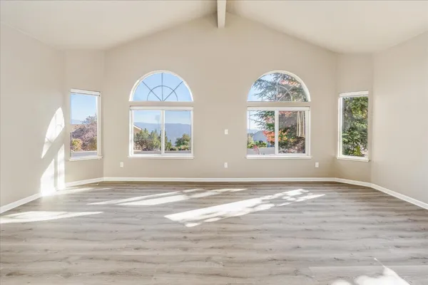 a view of windows and hall with wooden floor