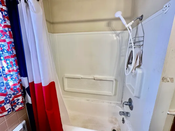 a bedroom with furniture and a wooden floor