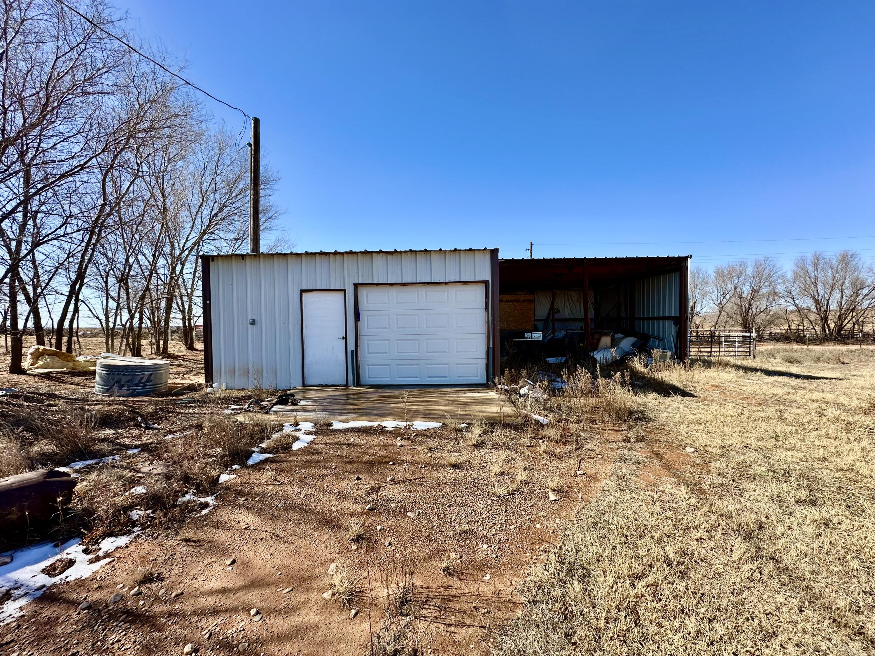 488 Co Road 4 Turkey, TX 79261 - Photo 25 of 29 a backyard of a house with table and chairs