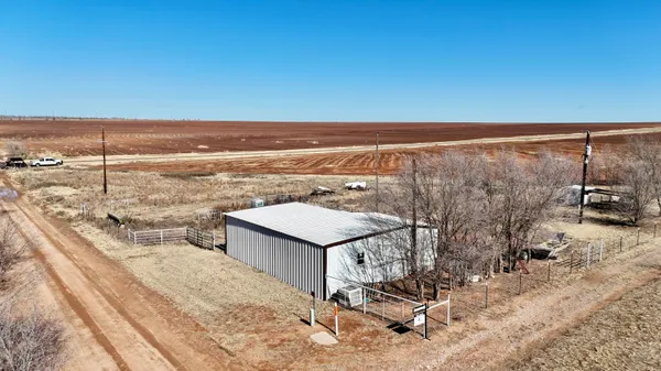 a view of a backyard with sitting area