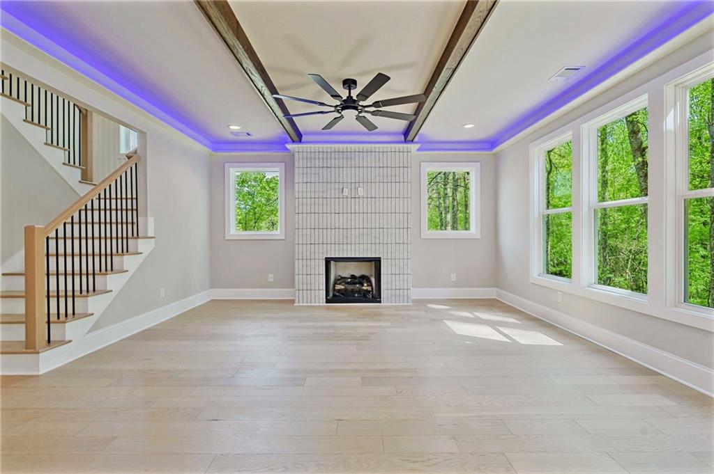 1697 Eastside Parc Street Atlanta, GA 30316 - Photo 12 of 44 a view of an empty room with a fireplace and a window