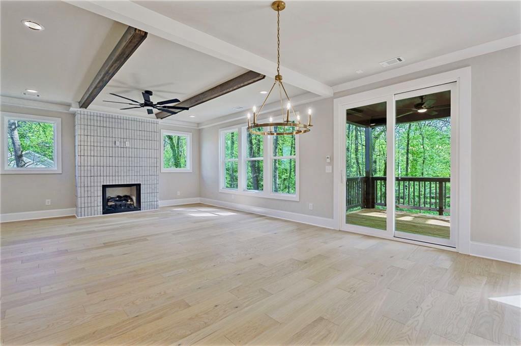1697 Eastside Parc Street Atlanta, GA 30316 - Photo 13 of 44 a view of an empty room with a fireplace and a window