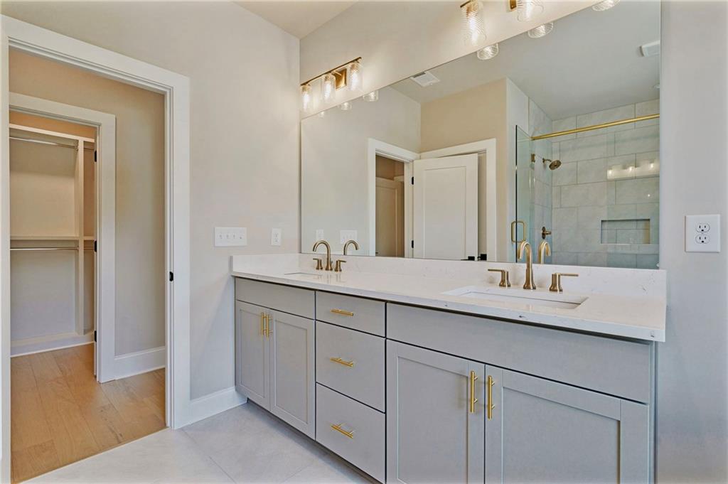 1697 Eastside Parc Street Atlanta, GA 30316 - Photo 25 of 44 a bathroom with a double vanity sink and mirror