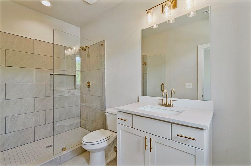 1697 Eastside Parc Street Atlanta, GA 30316 - Photo 30 of 44 a bathroom with a sink toilet and shower