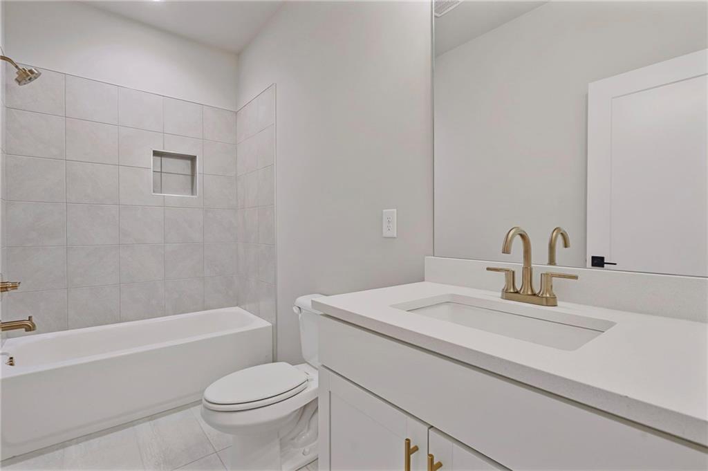 1697 Eastside Parc Street Atlanta, GA 30316 - Photo 35 of 44 a bathroom with a sink toilet and shower