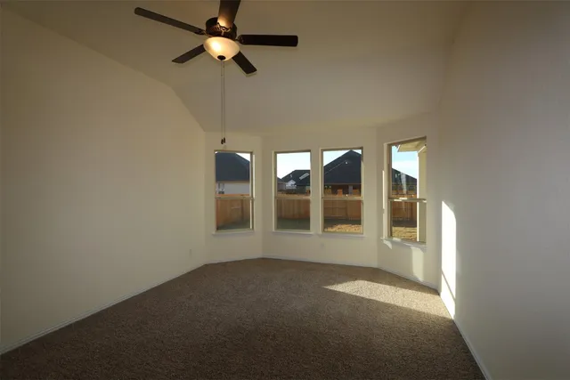 a large kitchen with stainless steel appliances kitchen island granite countertop a stove a refrigerator a sink dishwasher and a oven with wooden floor