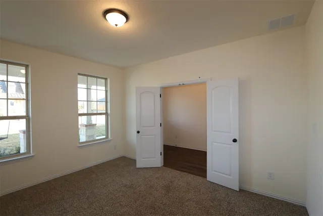 a view of a kitchen with a sink and a window