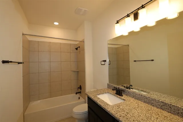 a bathroom with a tub and a shower