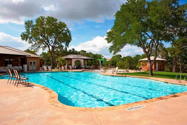 a view of swimming pool with seating space