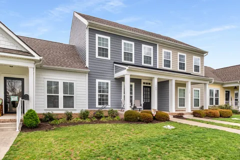 a view of a house with a yard and plants