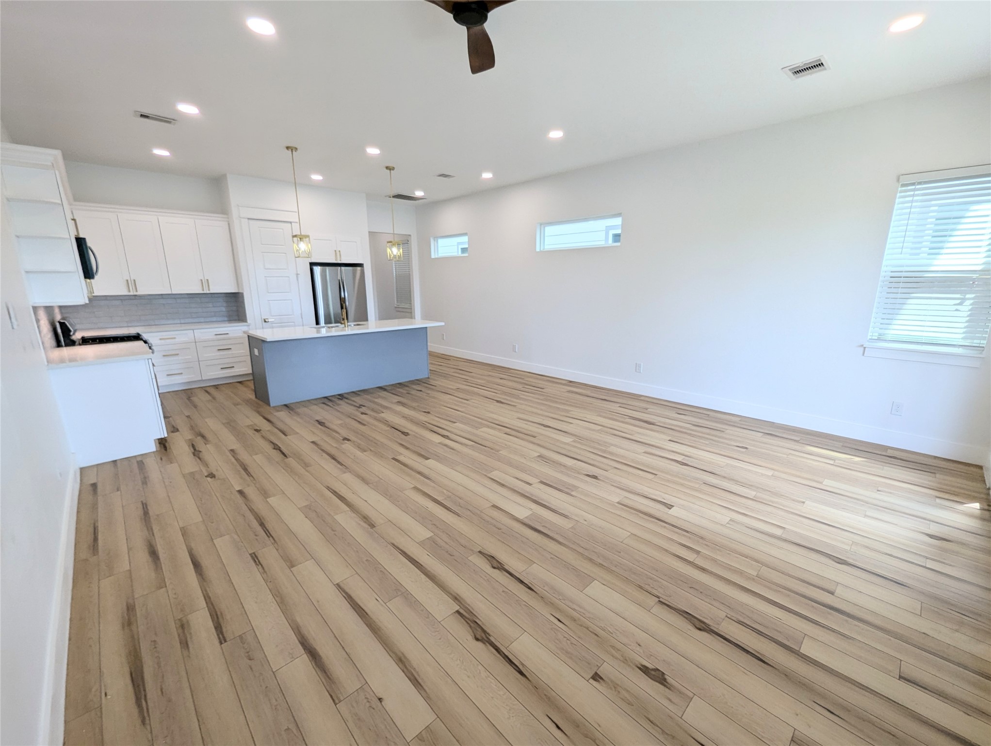 4913 Fisk Street Houston, TX 77009 - Photo 11 of 27 a view of kitchen view wooden floor and window