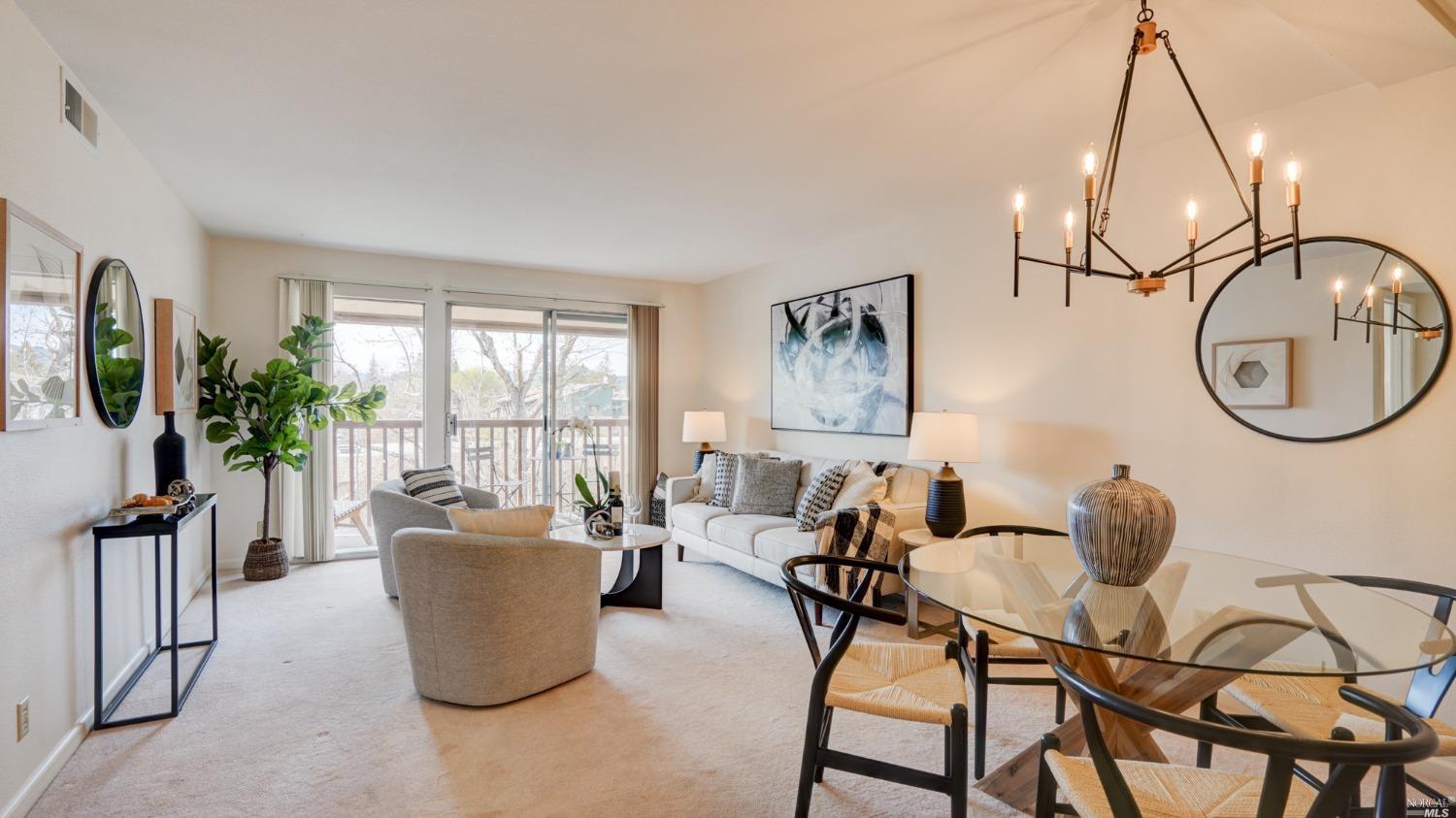 1540 Center Road, Unit 380 Novato, CA 94947 - Photo 1 of 1 a living room with furniture a window and a flat screen tv