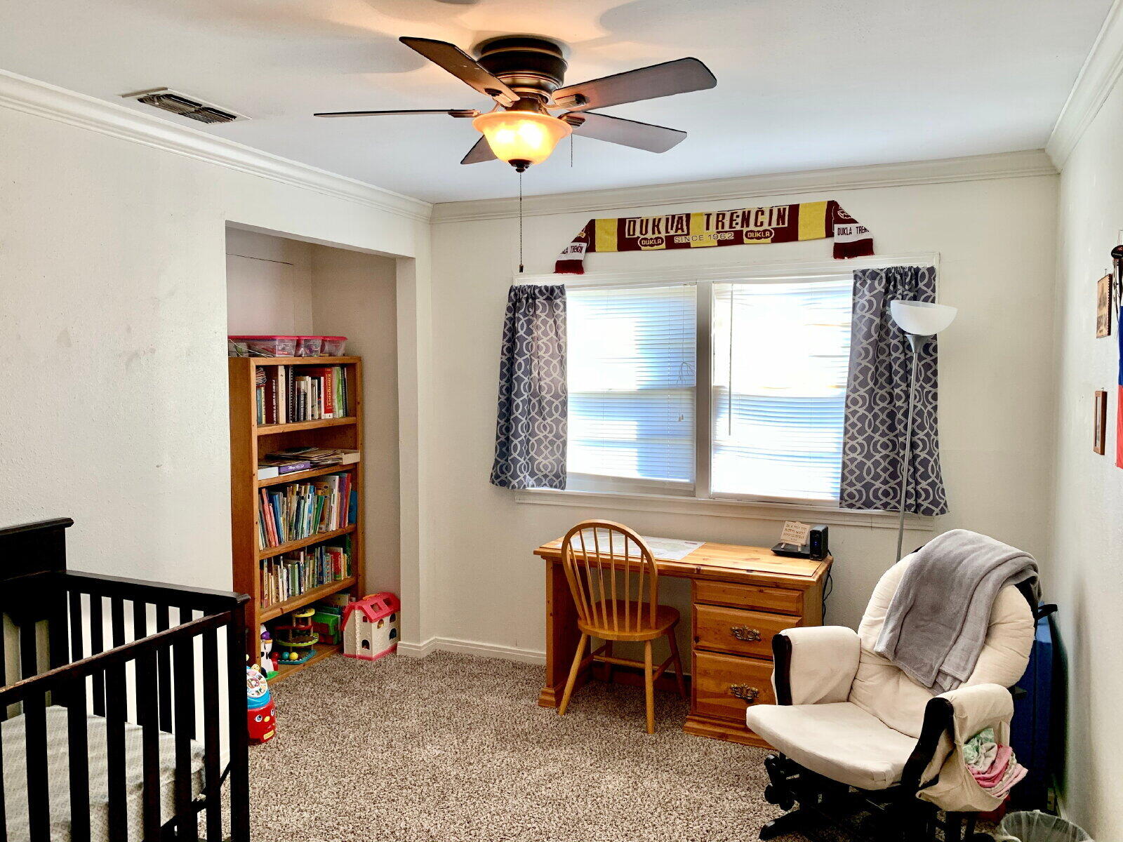 4206 45th Street Lubbock, TX 79413 - Photo 6 of 14 a bedroom with furniture and a window