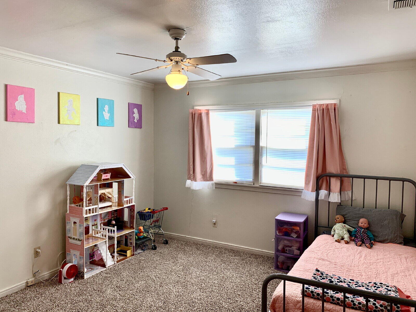 4206 45th Street Lubbock, TX 79413 - Photo 7 of 14 a bedroom with furniture and a window