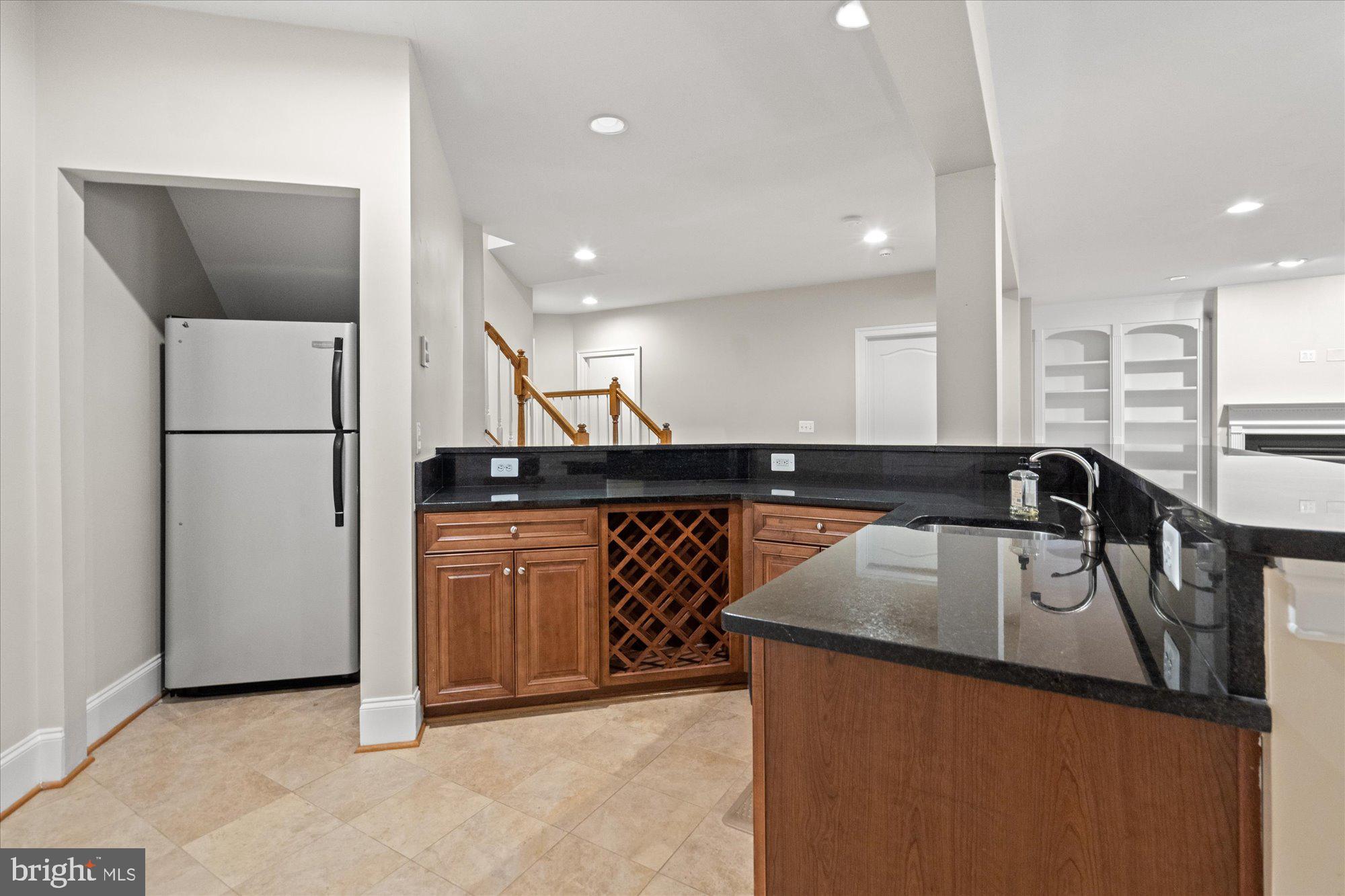 9300 Castle Hill Road Springfield, VA 22153 - Photo 51 of 60 Wet bar with refrigerator and dishwasher