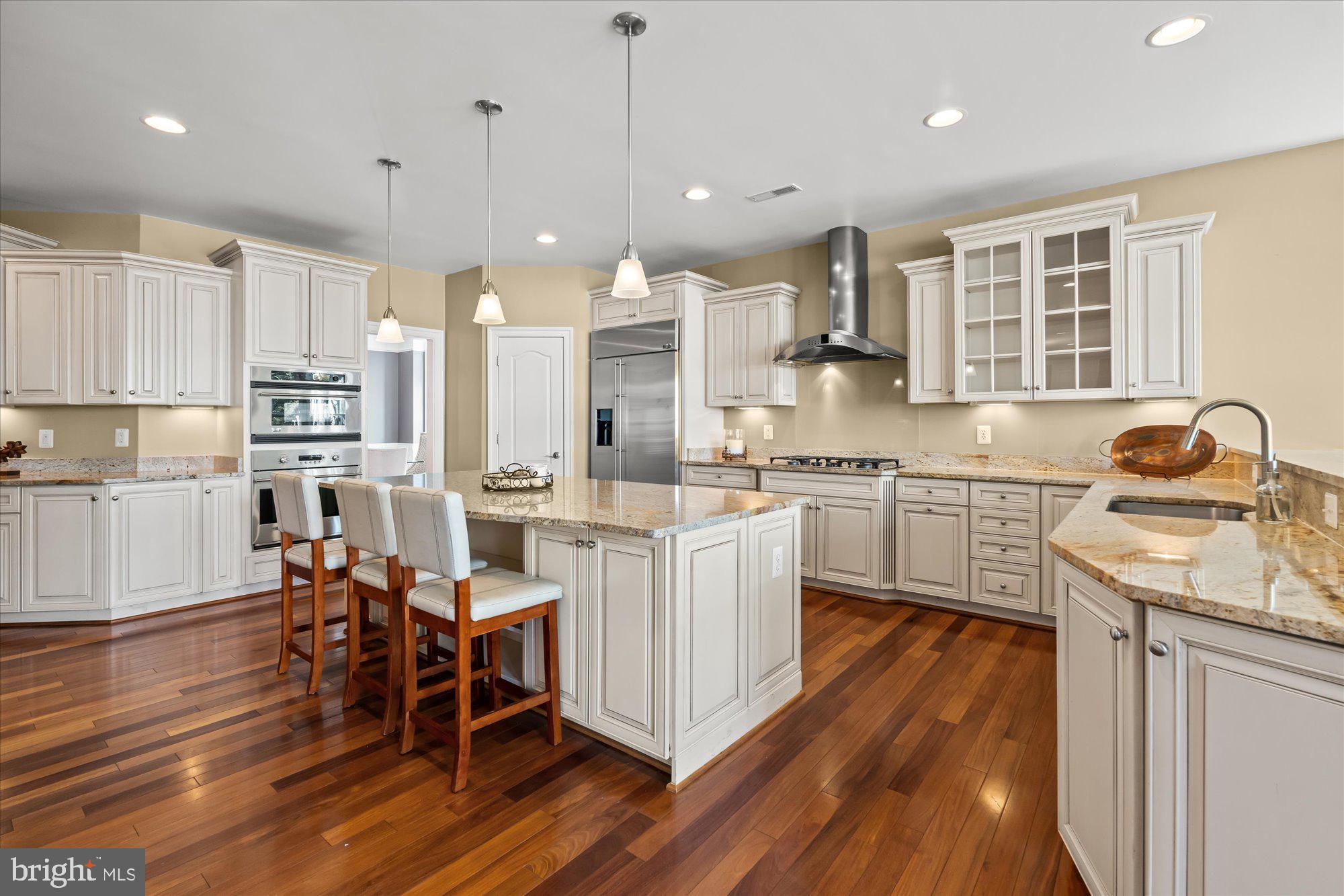 9300 Castle Hill Road Springfield, VA 22153 - Photo 9 of 60 Large island with seating overlooking cooking area