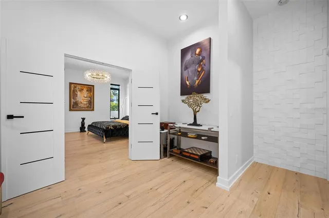 a view of room with a table and a chandelier