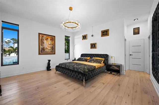 a bedroom with a bed and a dresser