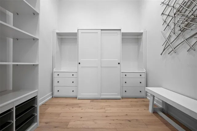 a bedroom with bed and a window