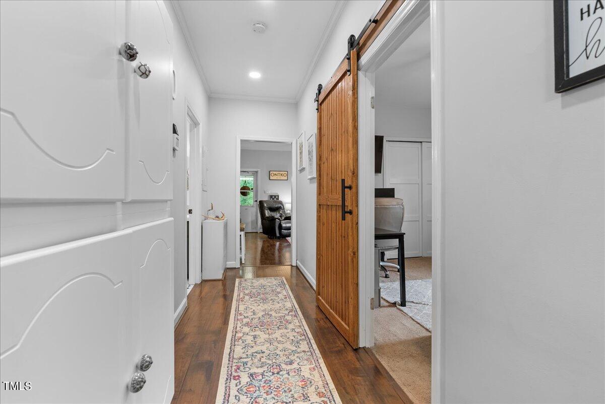 3151 Brogden Road Stem, NC 27581 - Photo 15 of 58 a bathroom with a tub shower and a sink