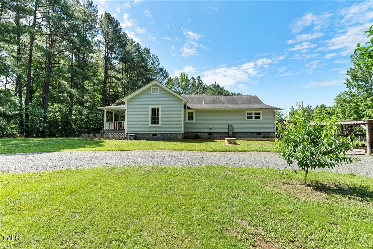 3151 Brogden Road Stem, NC 27581 - Photo 25 of 58 a view of house with a swimming pool