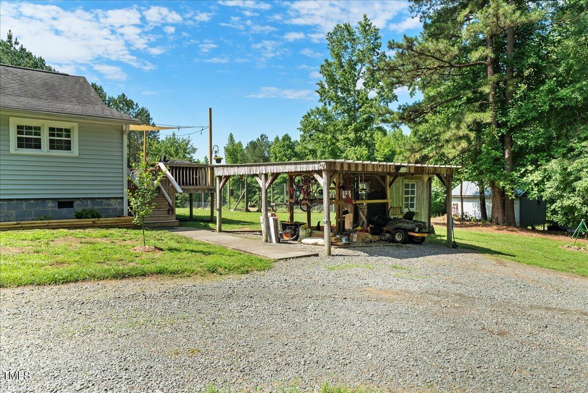 3151 Brogden Road Stem, NC 27581 - Photo 26 of 58 a view of a house with backyard and sitting area